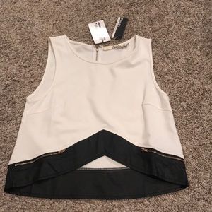White and black crop top with gold zipper detail